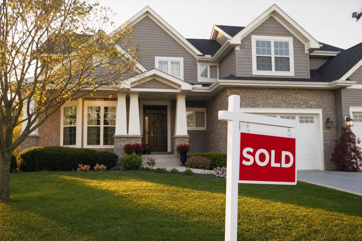 Well-maintained suburban home with a SOLD sign, energy-efficient homes command higher resale value